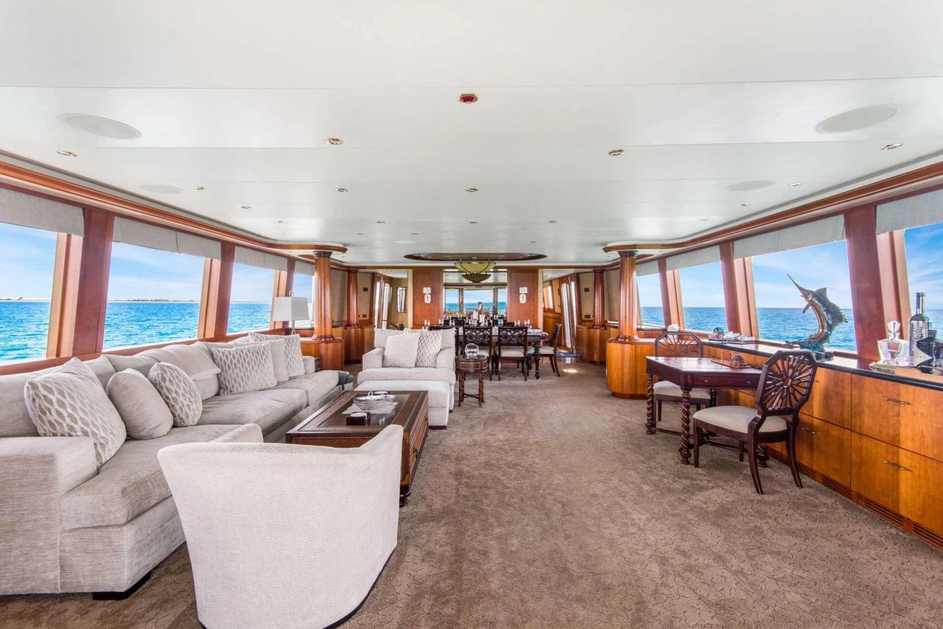 a living room with a couch and a table aboard PIPE DREAMS Yacht for Sale