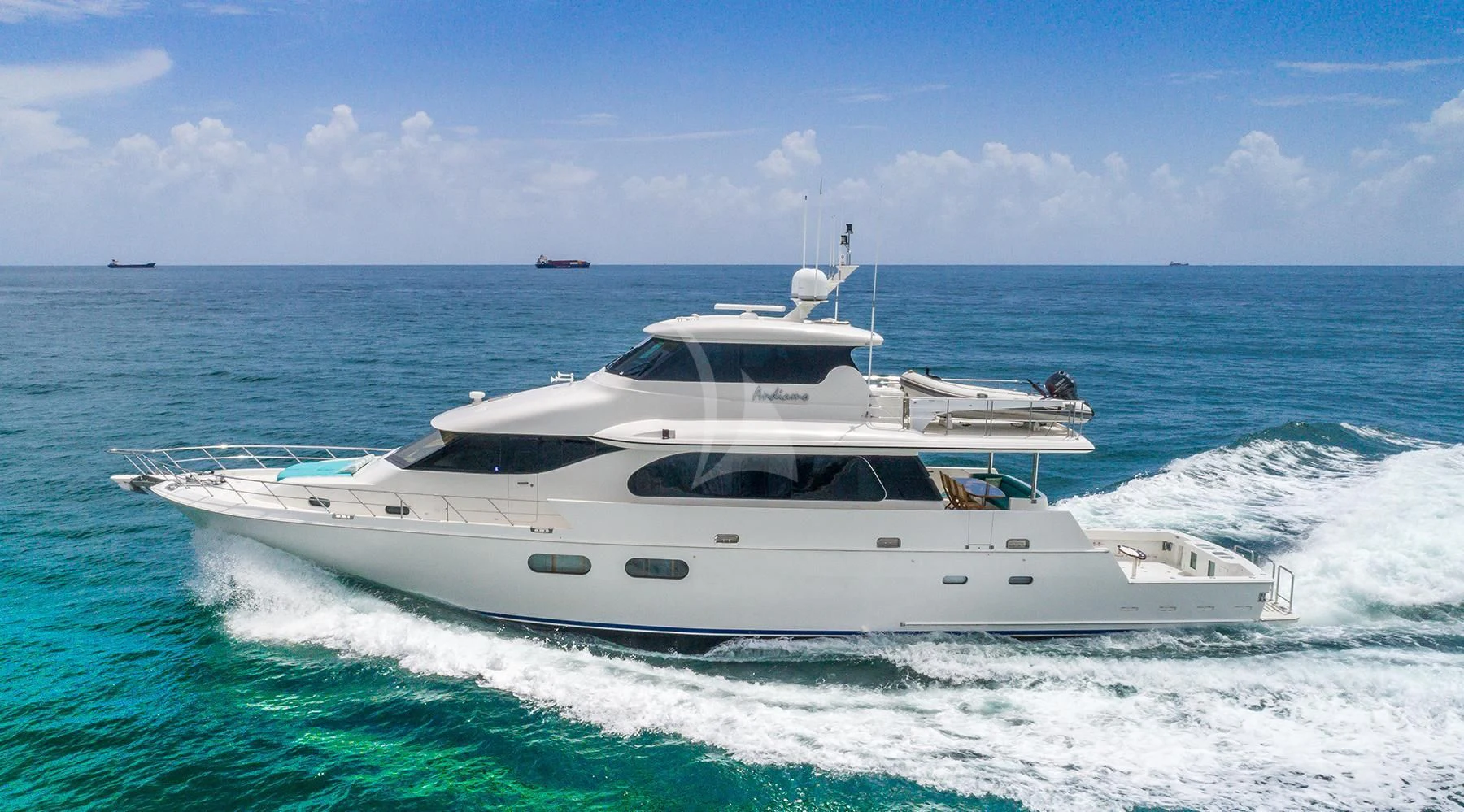 a white yacht on the water aboard ANDIAMO Yacht for Charter