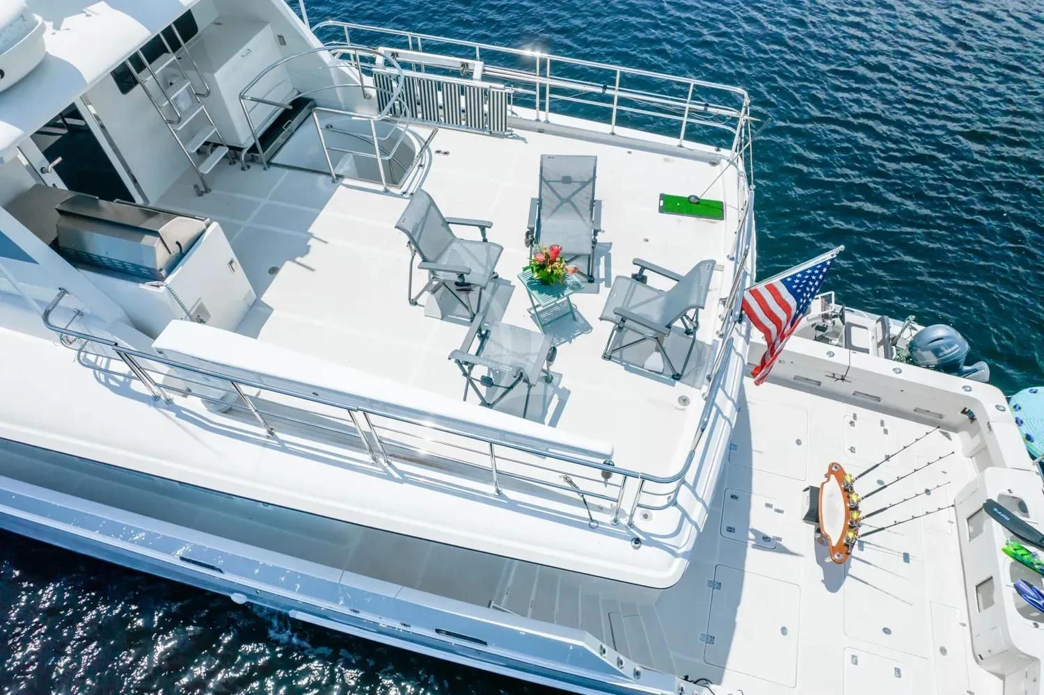 a large ship with a flag on the deck aboard ANDIAMO Yacht for Charter