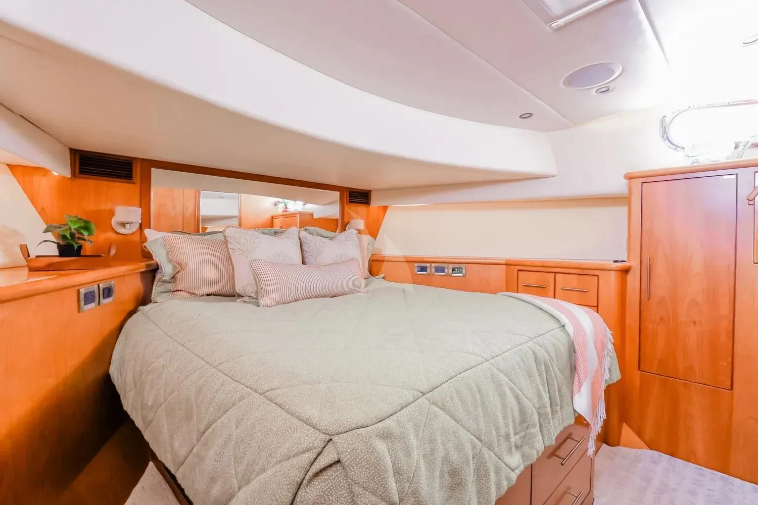 a bedroom with a bed and a desk aboard ANDIAMO Yacht for Charter