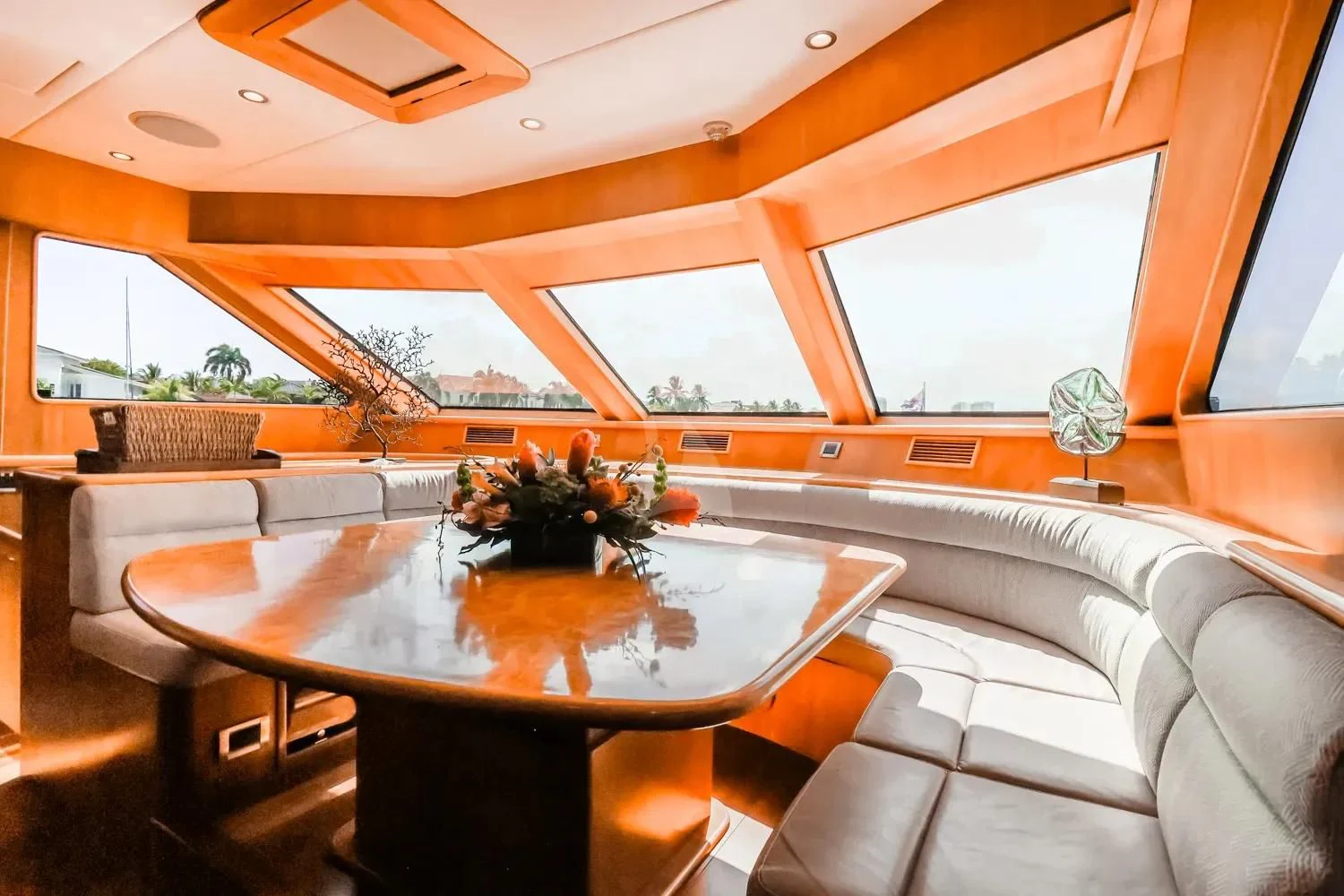 a room with a table and couches aboard ANDIAMO Yacht for Charter