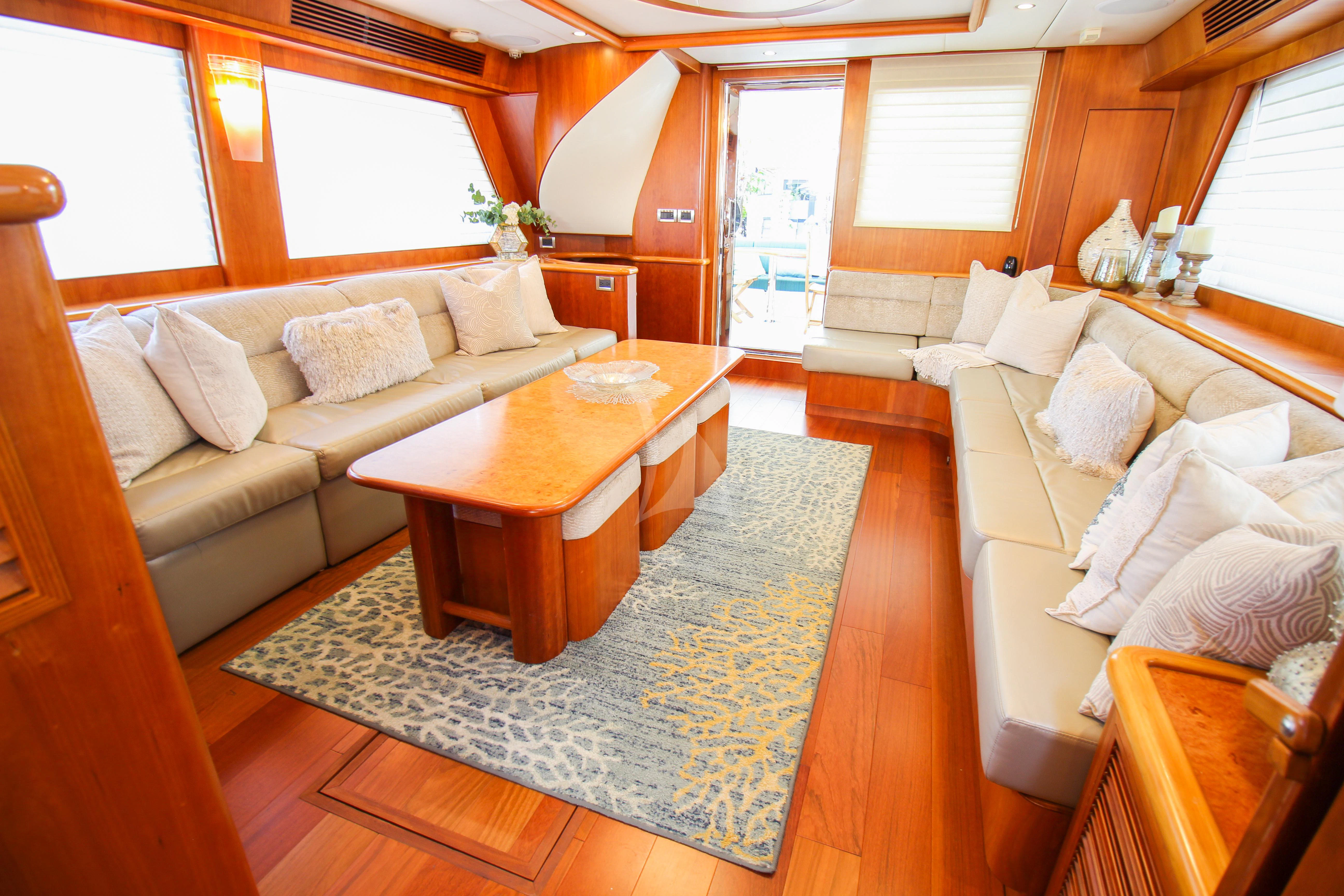 a living room with a couch and a coffee table aboard ANDIAMO Yacht for Charter