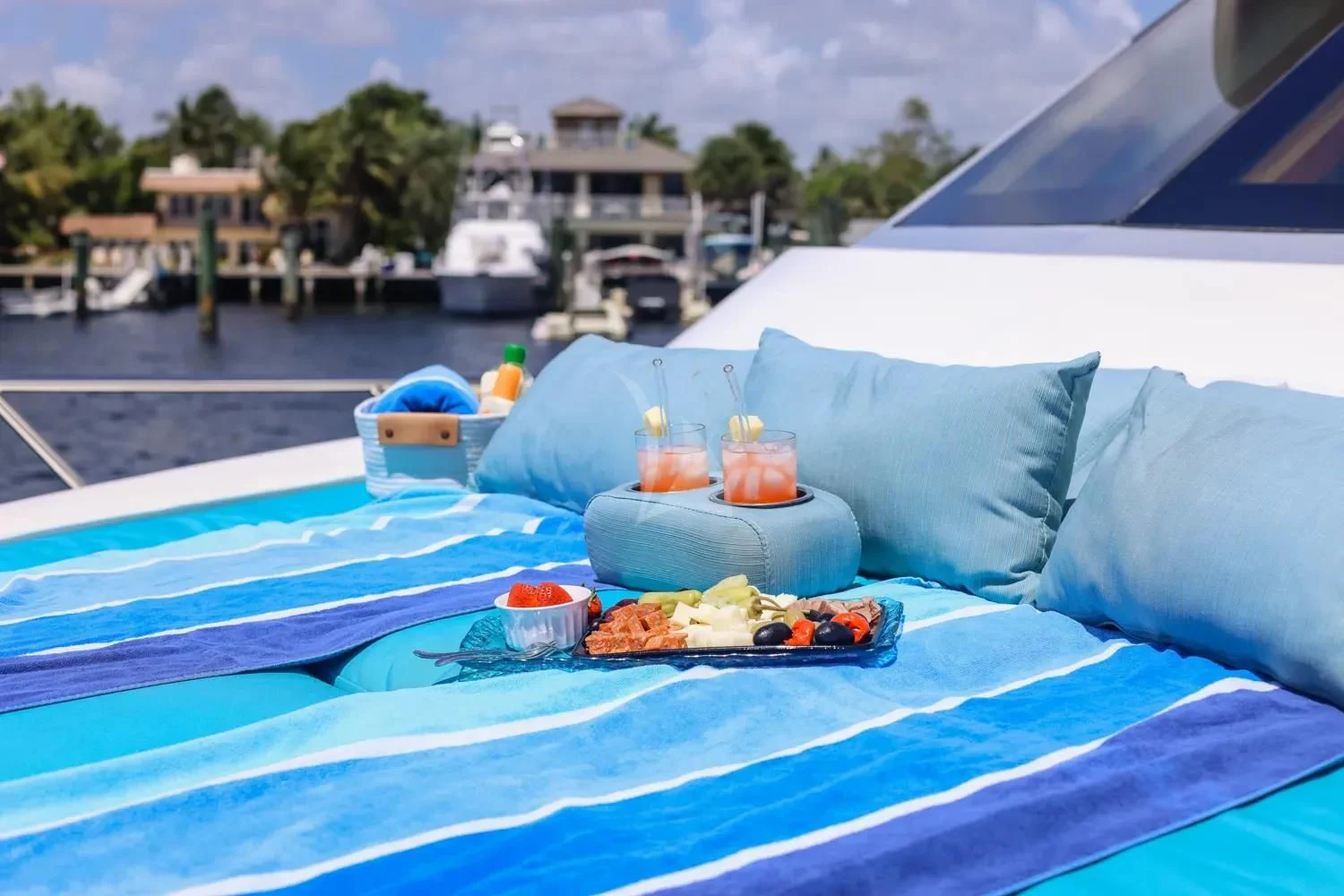 a pool with a blue roof and a blue and white striped tablecloth aboard ANDIAMO Yacht for Charter
