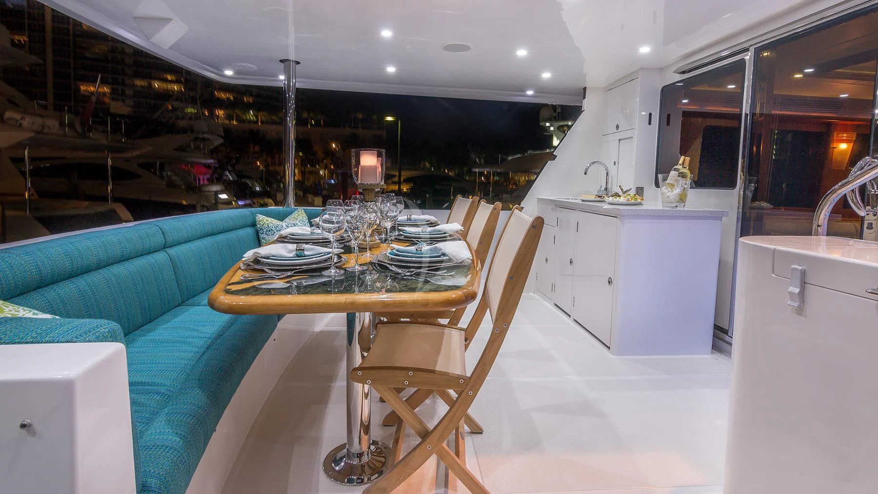 a kitchen with a table and chairs aboard ANDIAMO Yacht for Charter