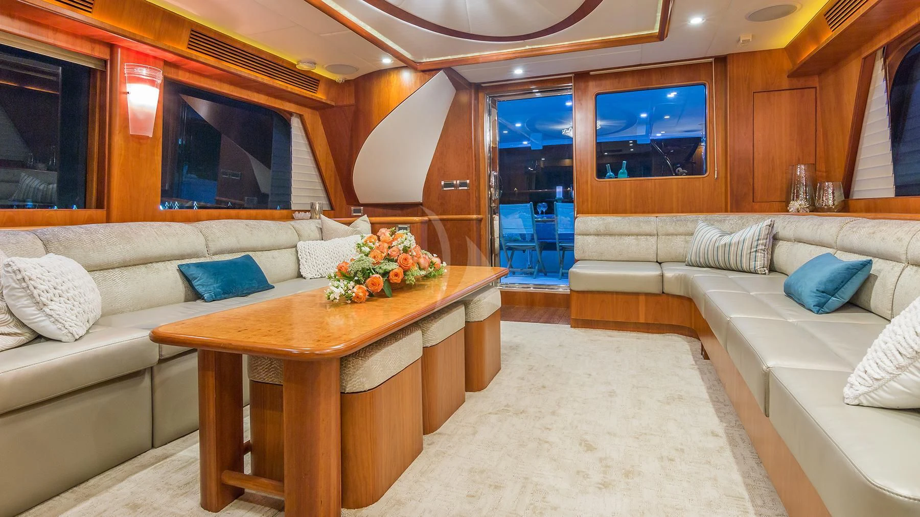 a room with a table and couch aboard ANDIAMO Yacht for Charter