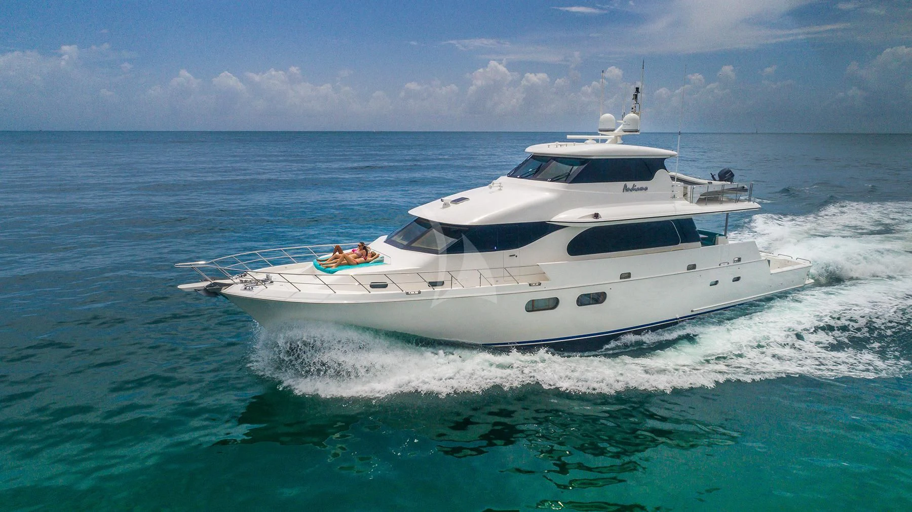 a white yacht on the water aboard ANDIAMO Yacht for Charter