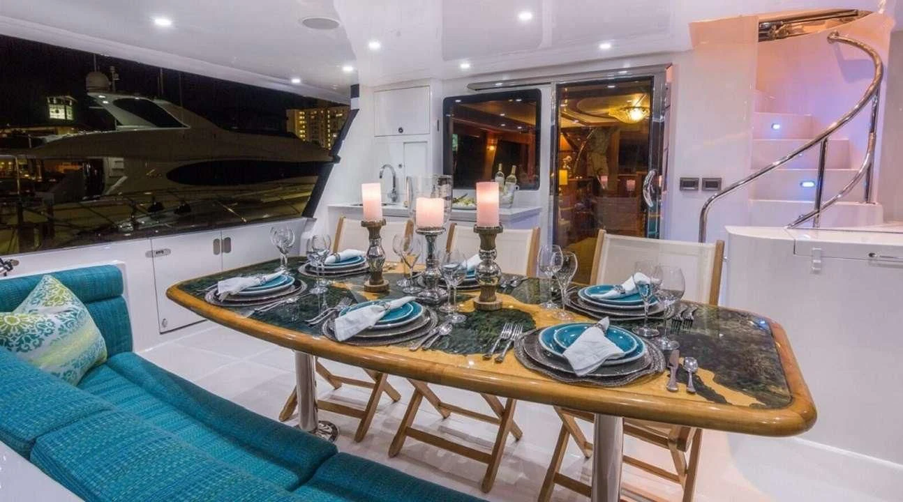 a dining room with a table and chairs aboard ANDIAMO Yacht for Charter