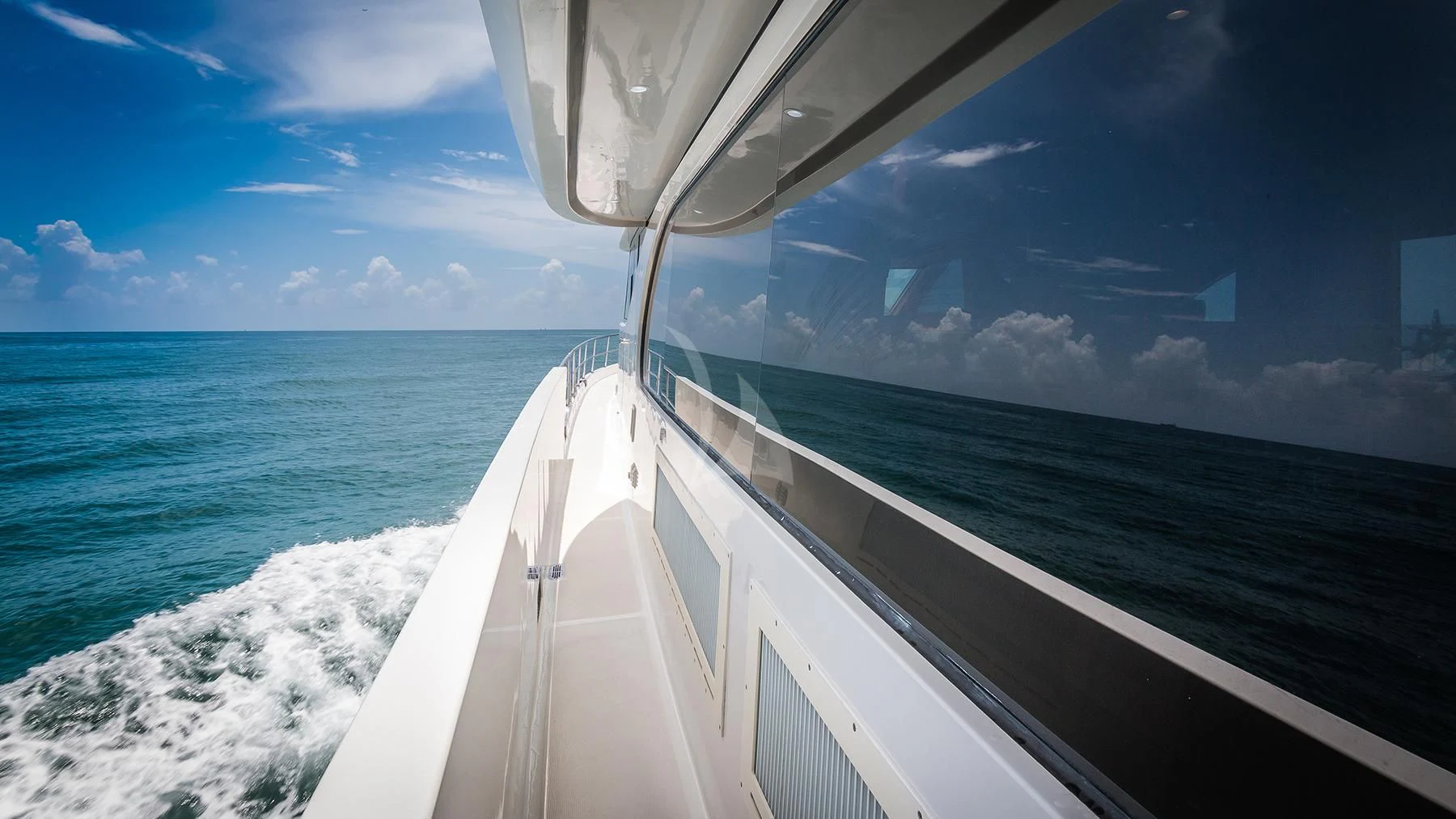 a white boat on the water aboard ANDIAMO Yacht for Charter