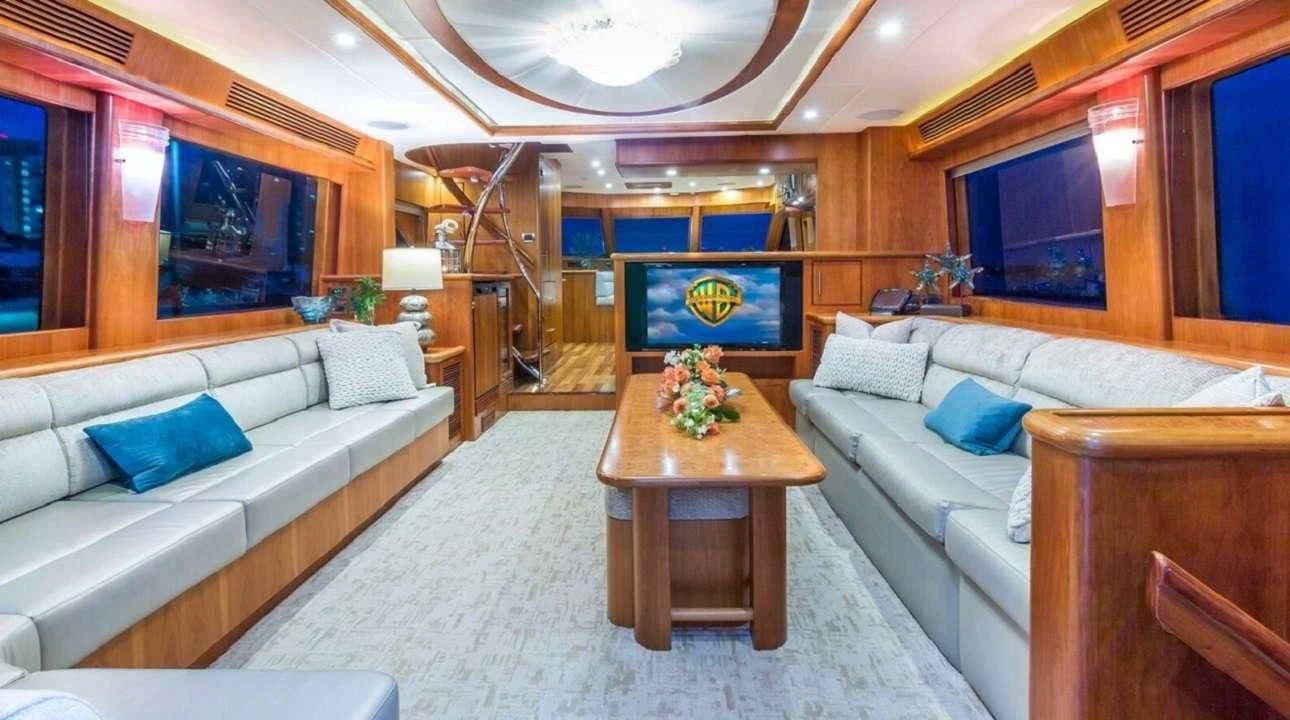 a living room with a couch and a coffee table aboard ANDIAMO Yacht for Charter