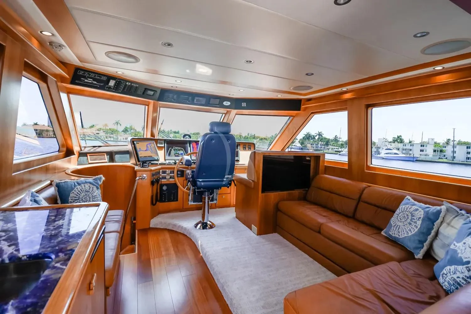 a living room with a large window aboard ANDIAMO Yacht for Charter