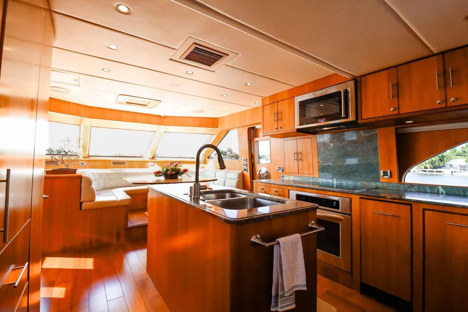 a kitchen with wooden cabinets aboard ANDIAMO Yacht for Charter