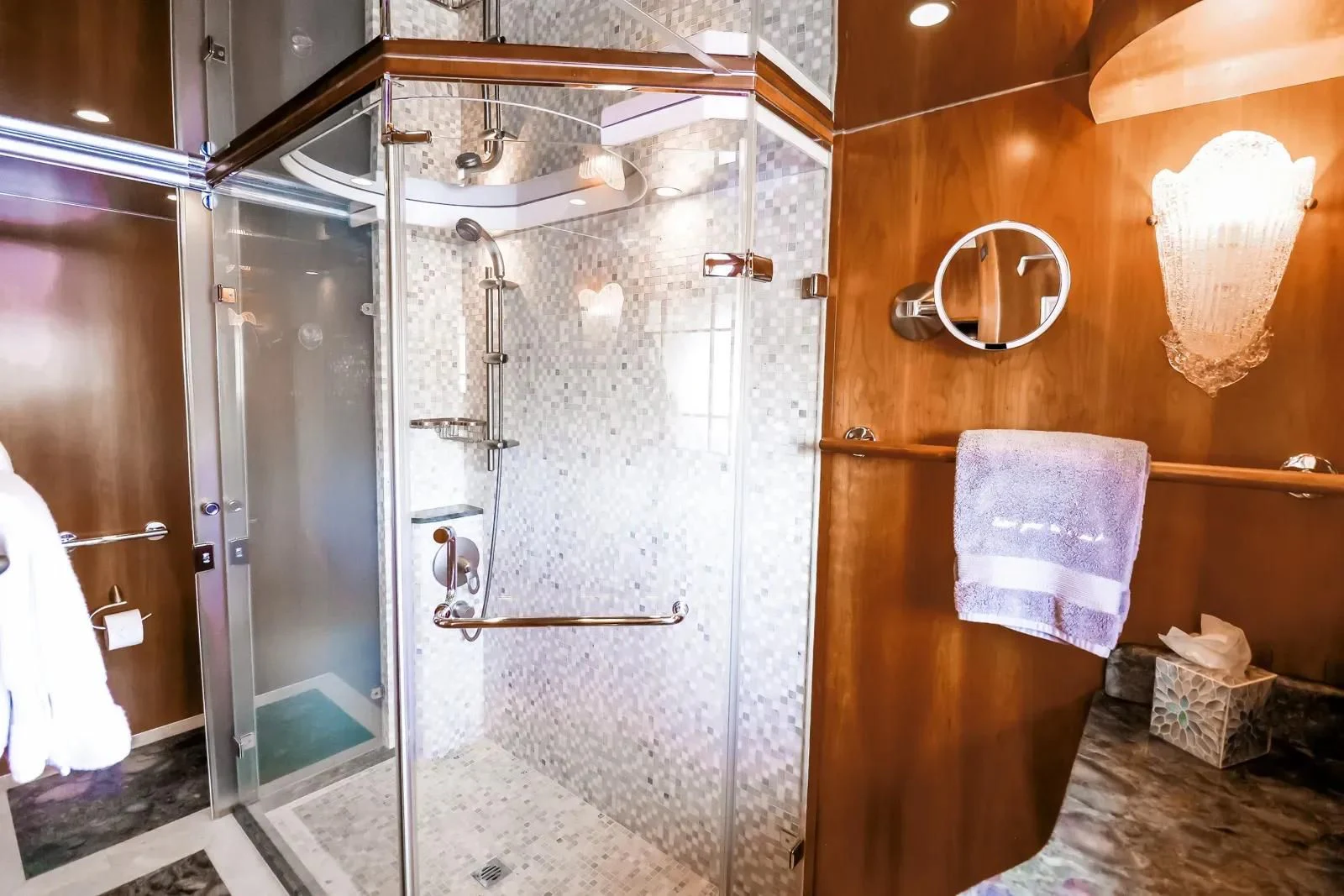 a shower unit in a bathroom aboard ANDIAMO Yacht for Charter