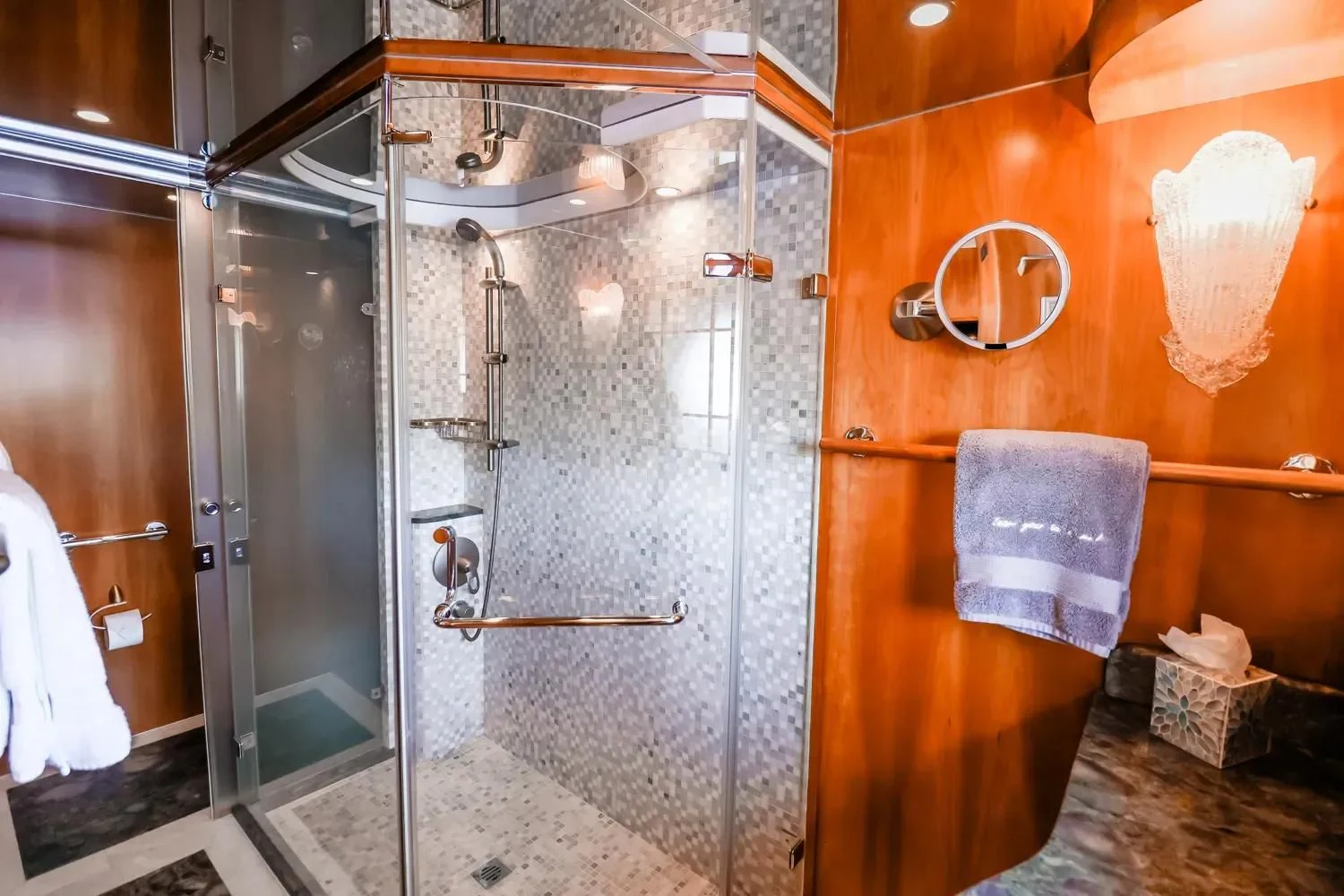 a shower unit in a bathroom aboard ANDIAMO Yacht for Charter