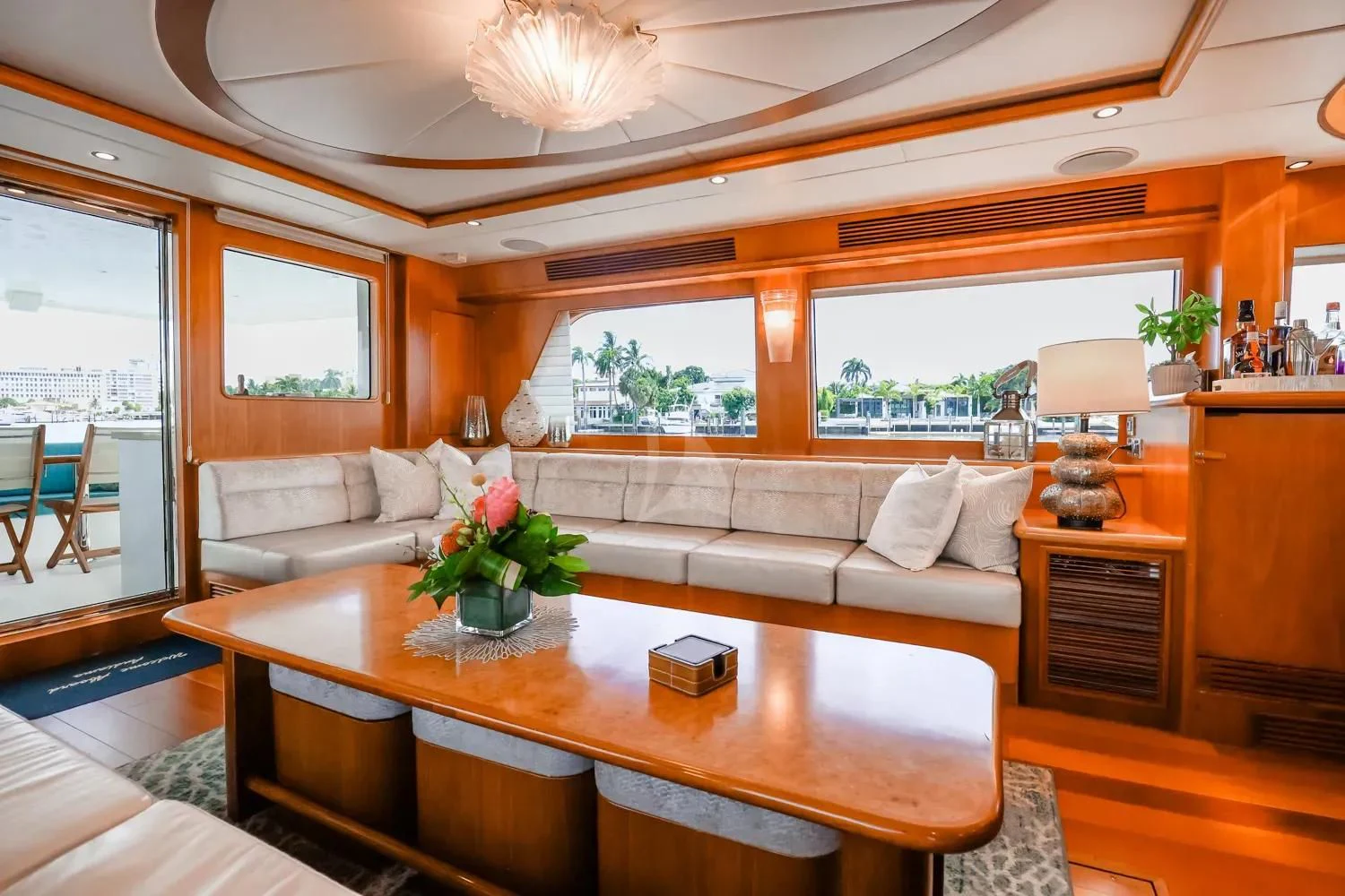 a living room with a table and couches aboard ANDIAMO Yacht for Charter