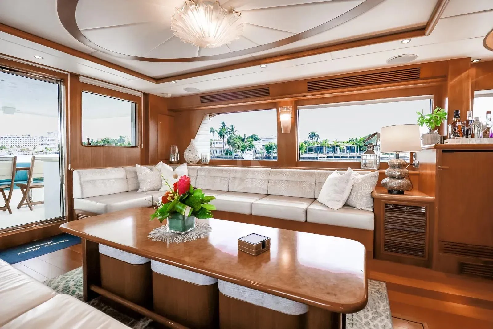 a living room with a table and couches aboard ANDIAMO Yacht for Charter