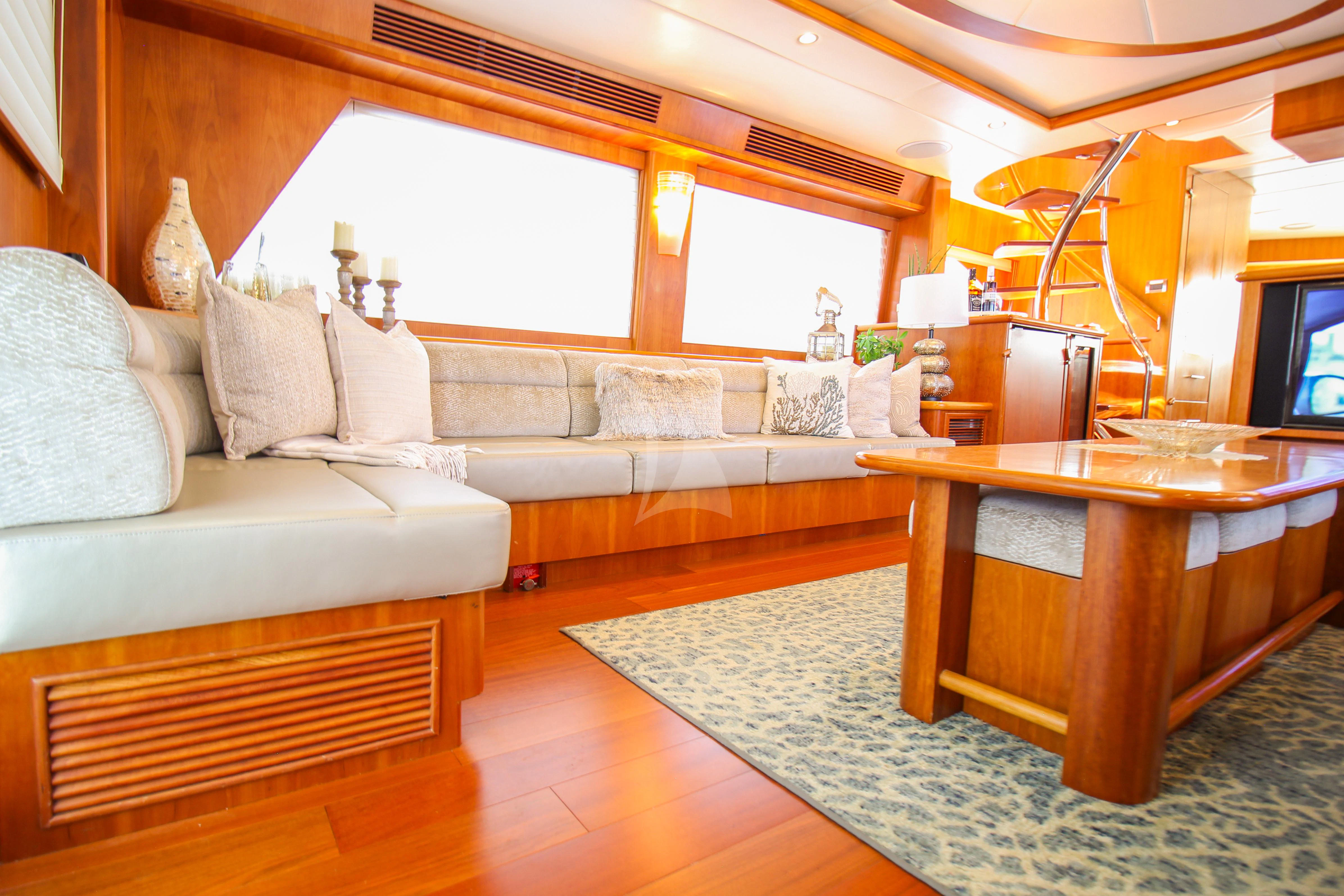 a living room with a couch and a coffee table aboard ANDIAMO Yacht for Charter