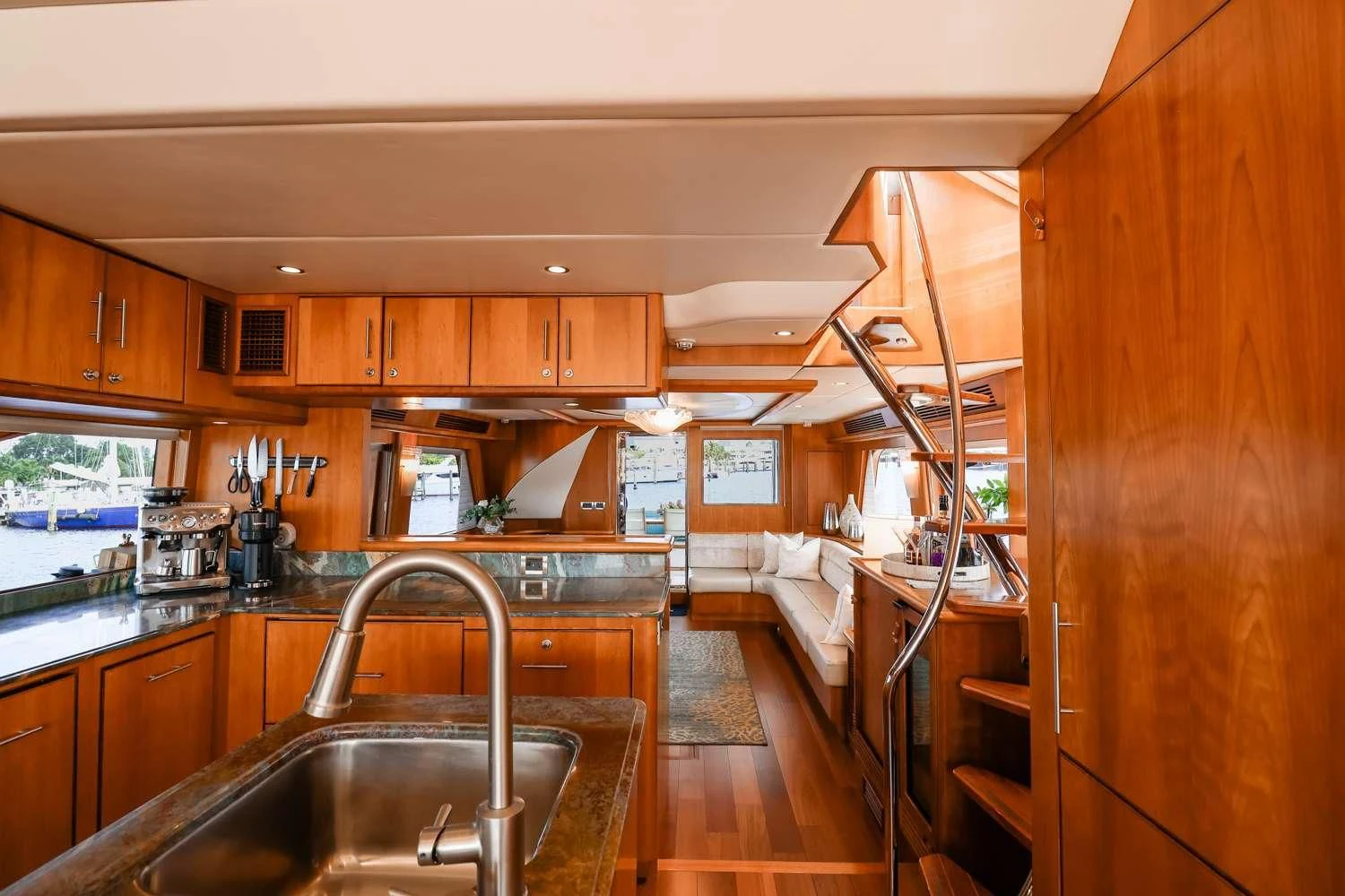 a kitchen with wooden cabinets aboard ANDIAMO Yacht for Charter