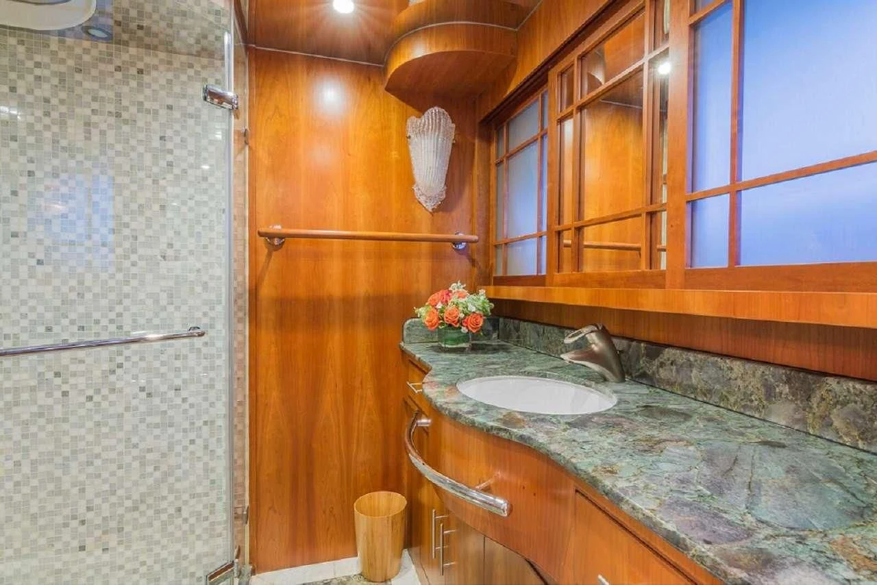 a bathroom with a sink and cabinets aboard ANDIAMO Yacht for Charter