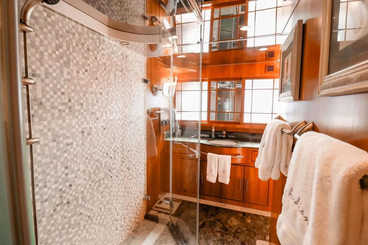 a bathroom with a shower curtain aboard ANDIAMO Yacht for Charter
