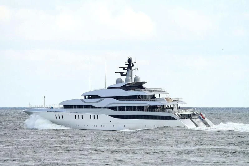 a large white boat on a beach aboard TANGO Yacht for Sale