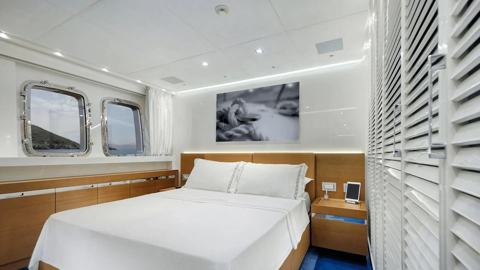 a bedroom with a large mirror aboard MORNING STAR Yacht for Charter