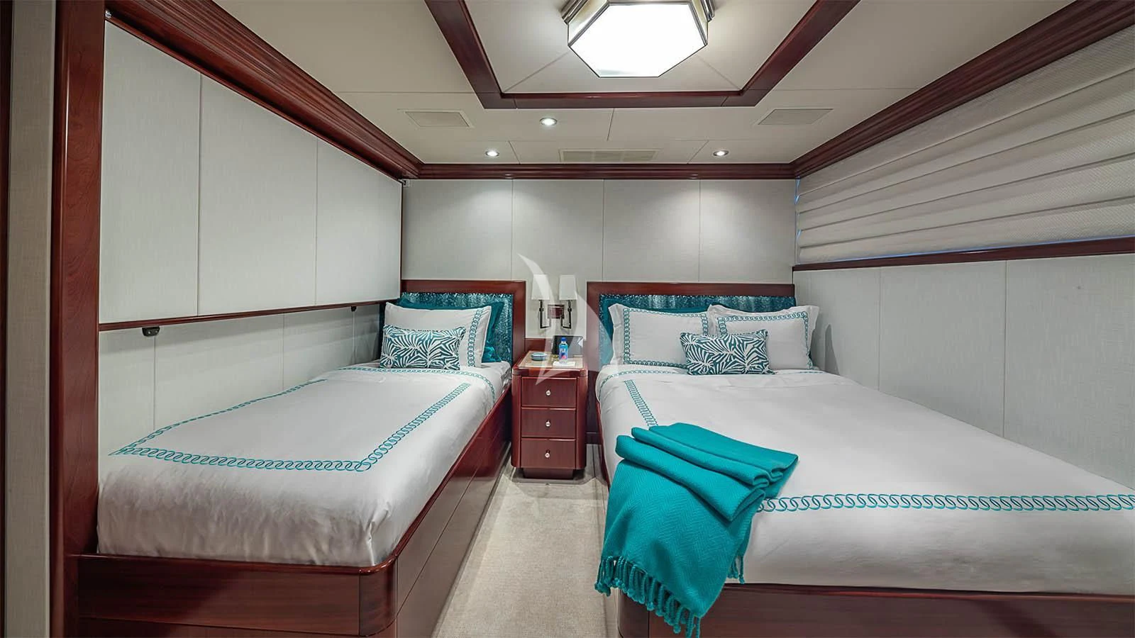 a couple of beds in a room aboard CARTE BLANCHE Yacht for Charter