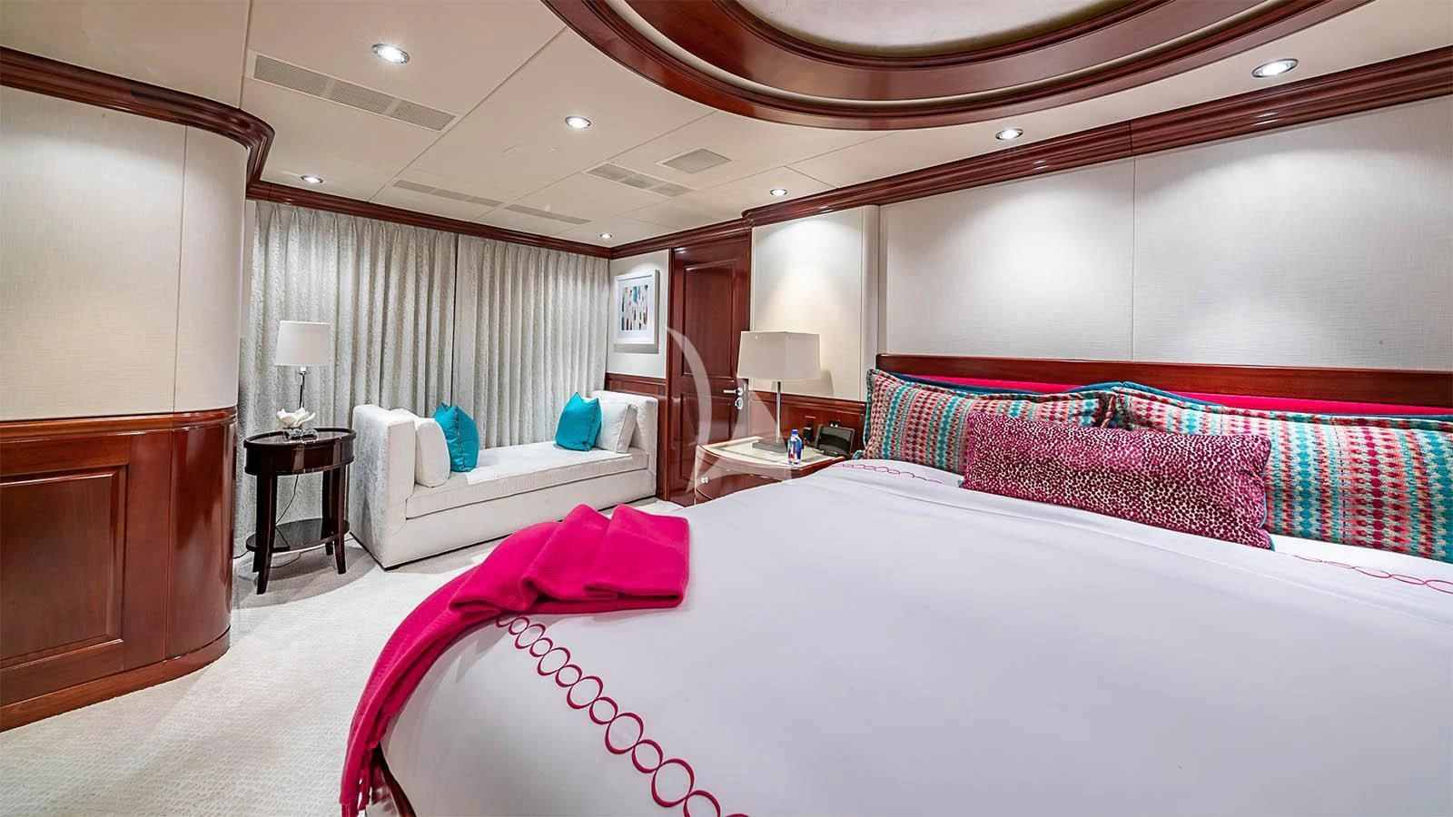 a room with a bed and a desk aboard CARTE BLANCHE Yacht for Charter
