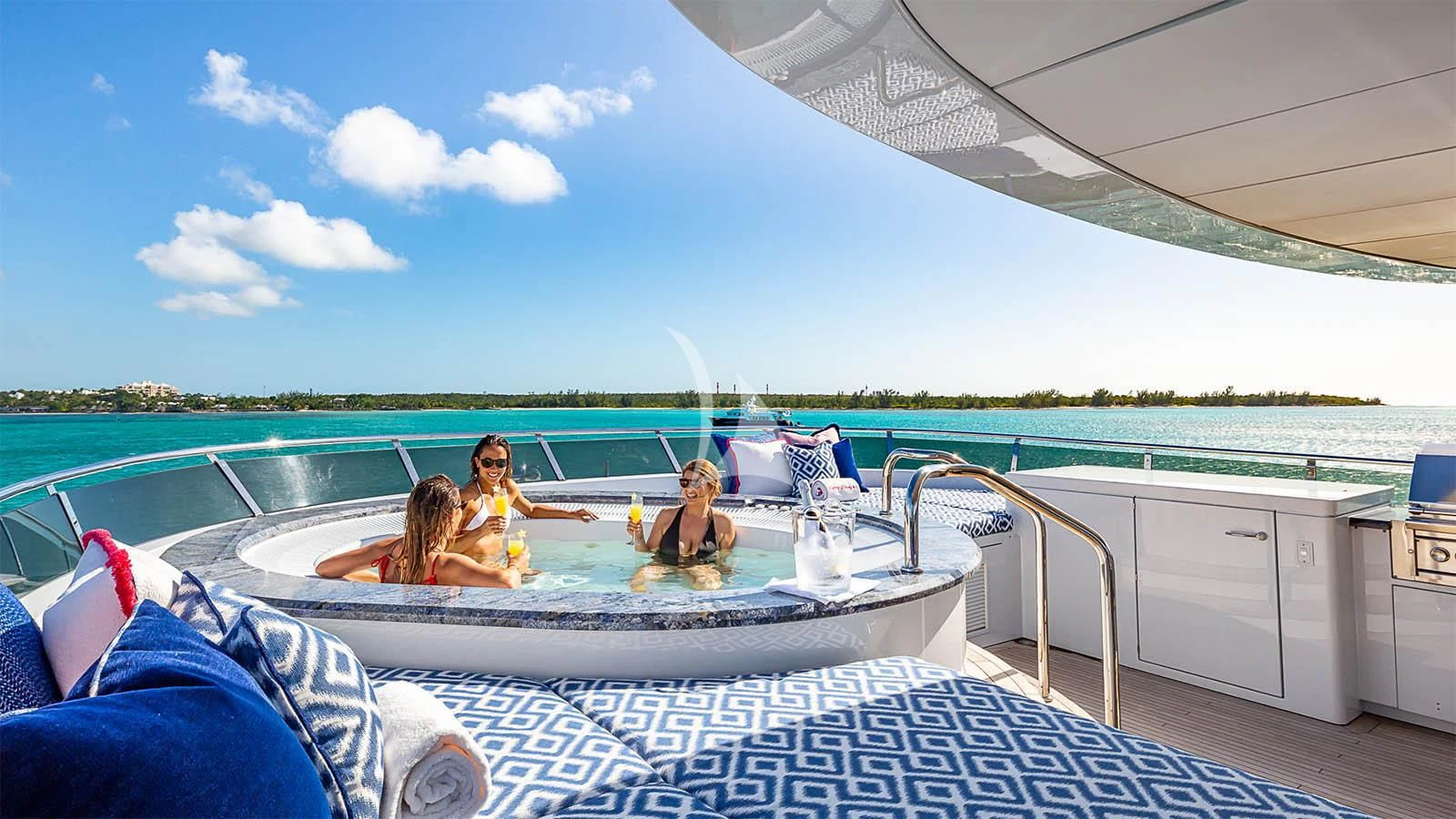 a group of people sitting in a pool aboard CARTE BLANCHE Yacht for Charter