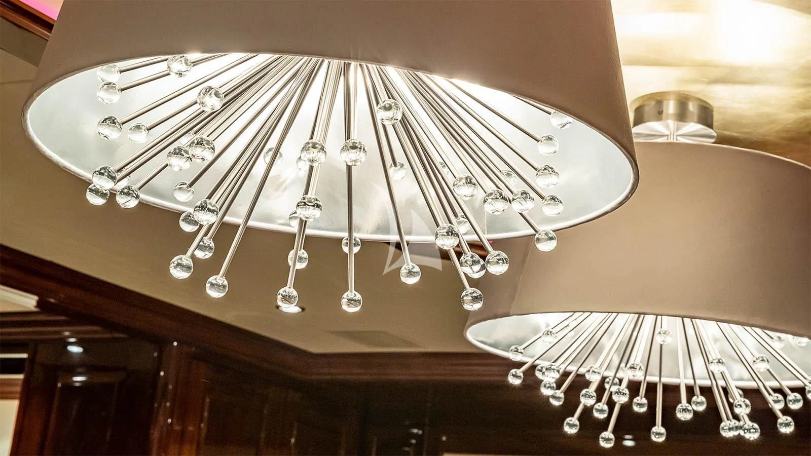 a chandelier from a ceiling aboard CARTE BLANCHE Yacht for Charter