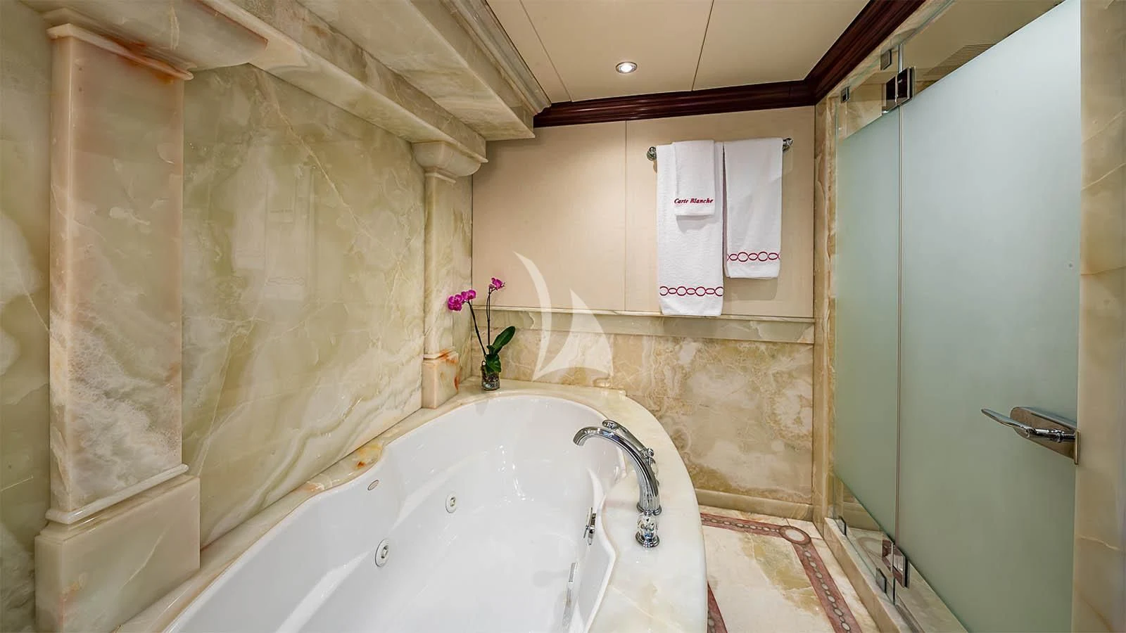 a bathtub and shower in a bathroom aboard CARTE BLANCHE Yacht for Charter