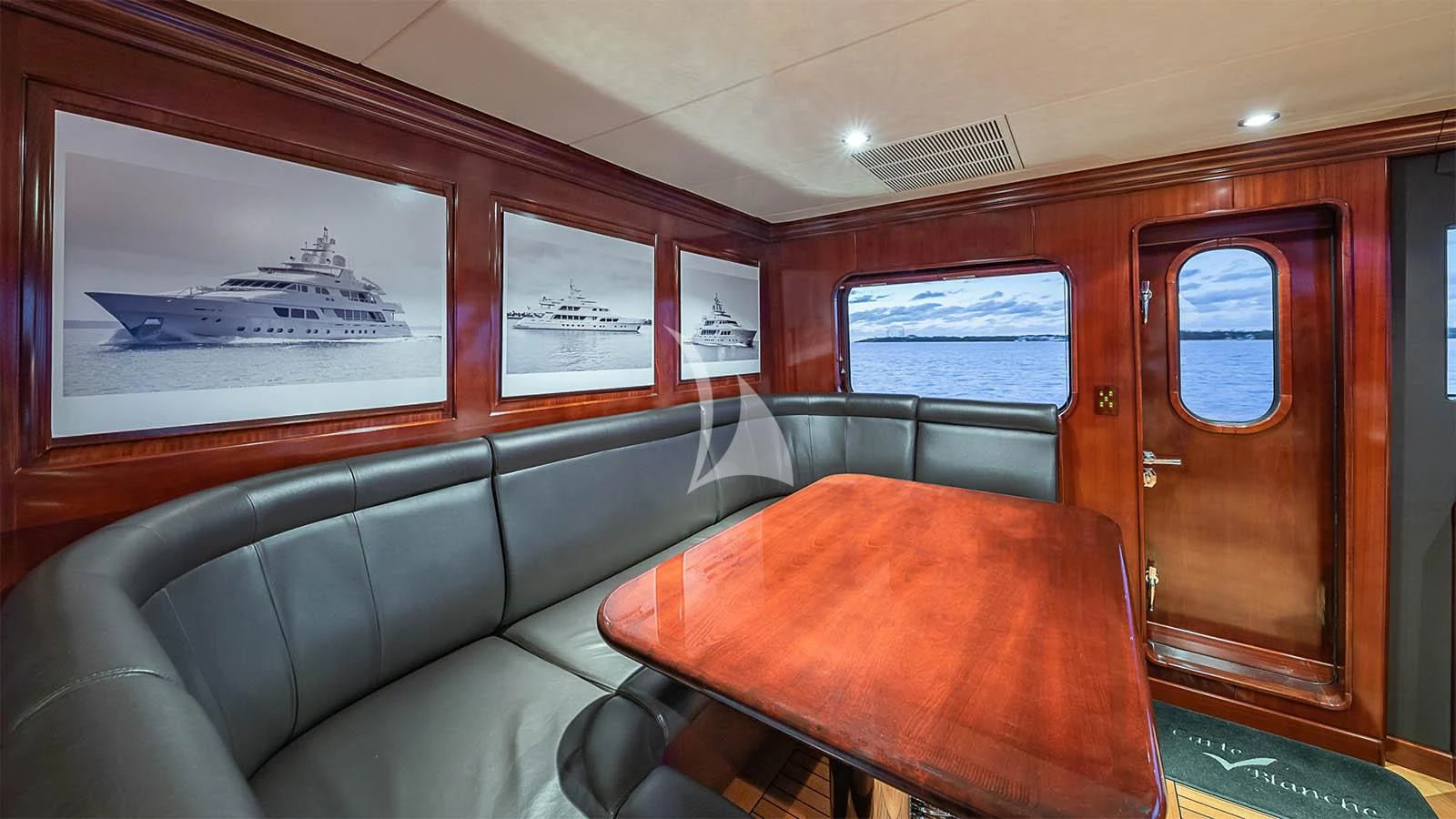 a room with a couch and a table aboard CARTE BLANCHE Yacht for Charter