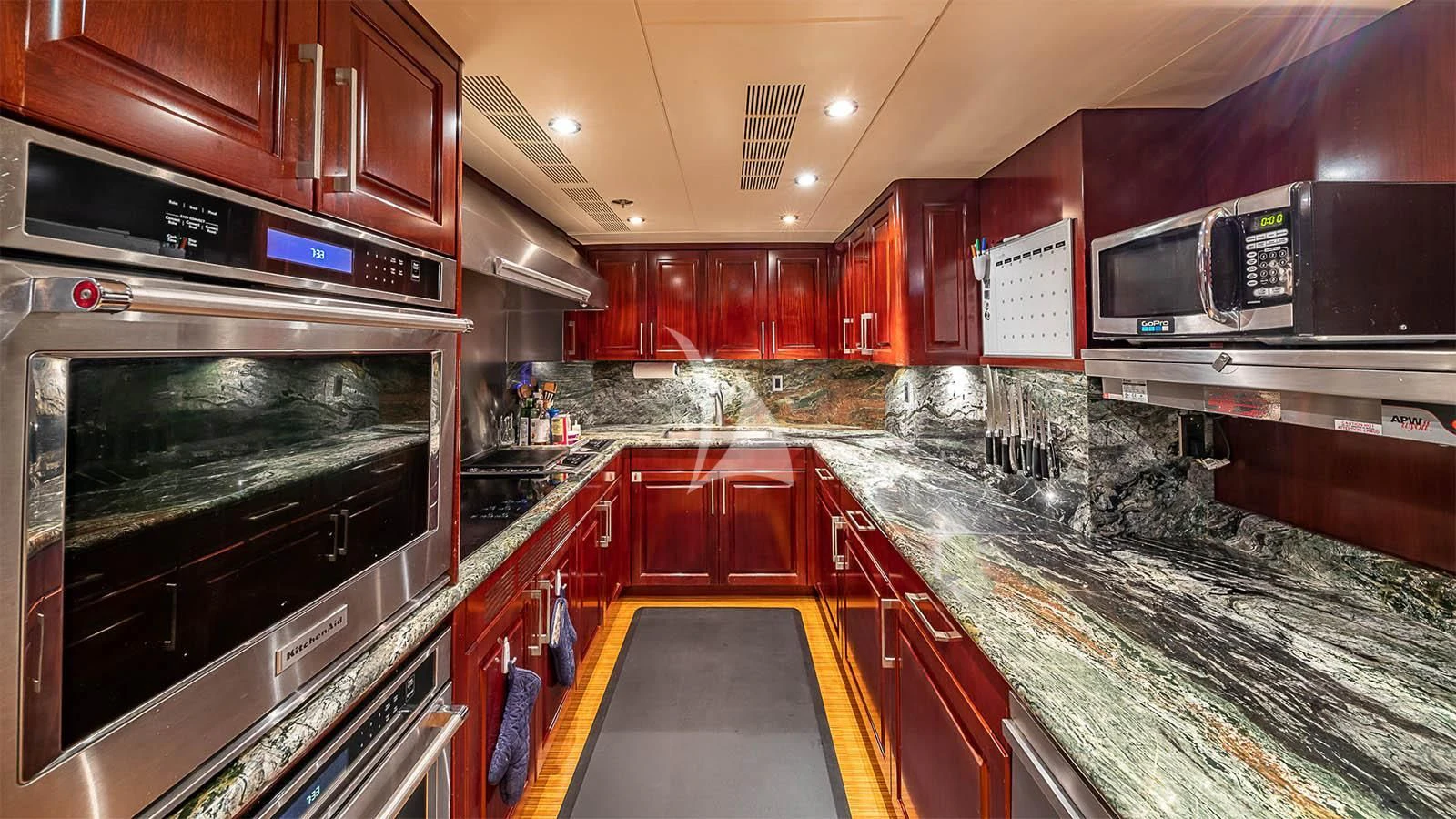 a kitchen with a large island aboard CARTE BLANCHE Yacht for Charter