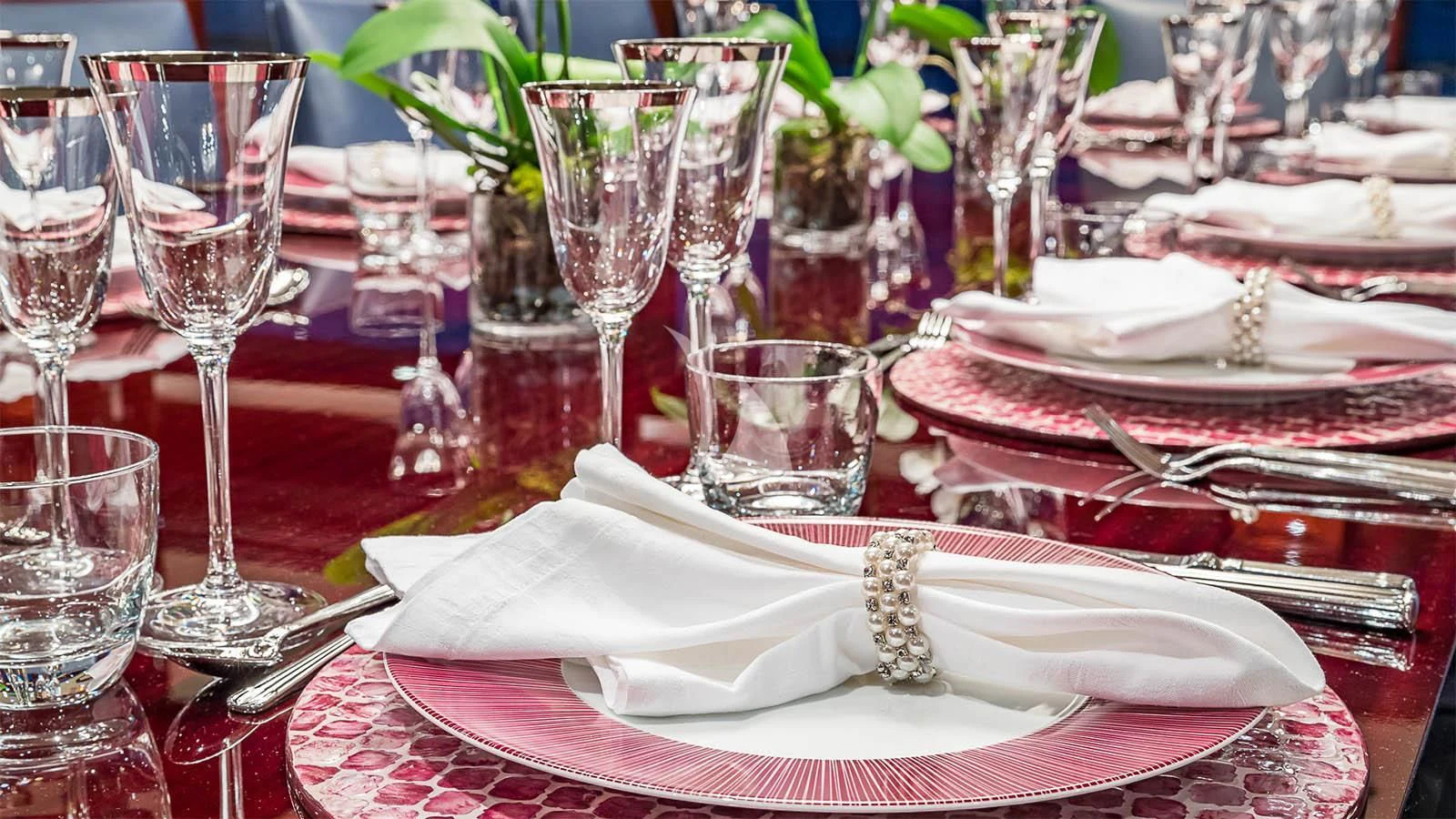 a table with plates and glasses aboard CARTE BLANCHE Yacht for Charter