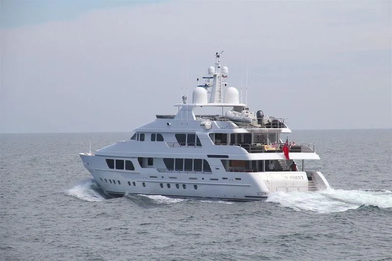 a large white boat on the water aboard CARTE BLANCHE Yacht for Charter