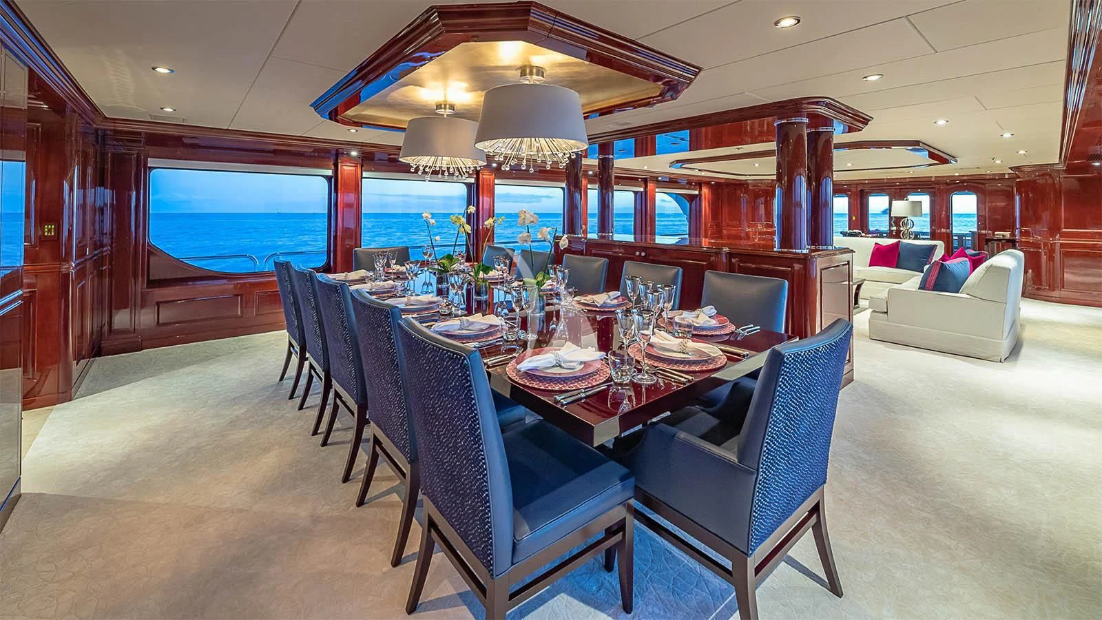 a dining room with a table and chairs aboard CARTE BLANCHE Yacht for Charter