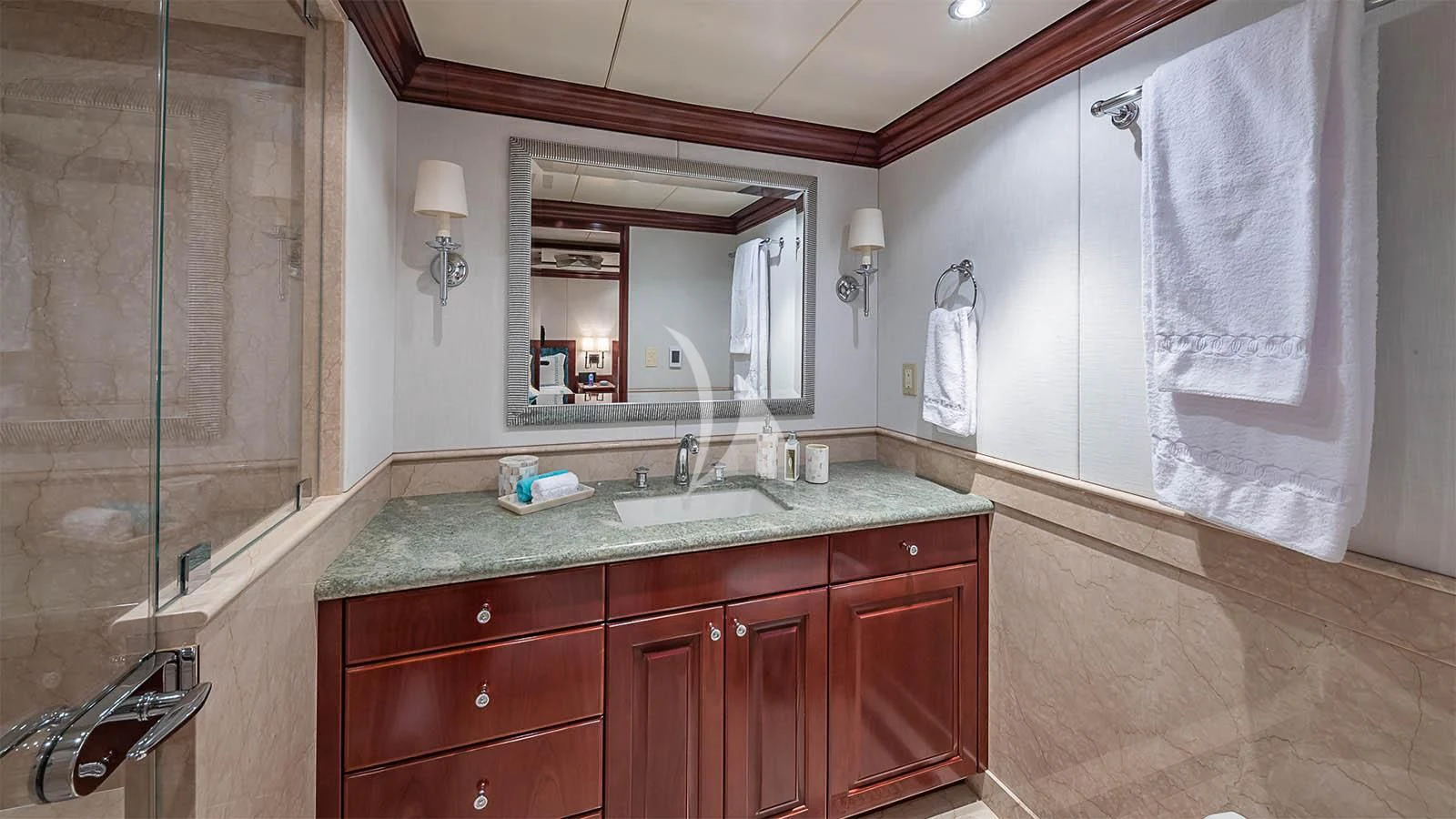 a bathroom with a sink and a mirror aboard CARTE BLANCHE Yacht for Charter