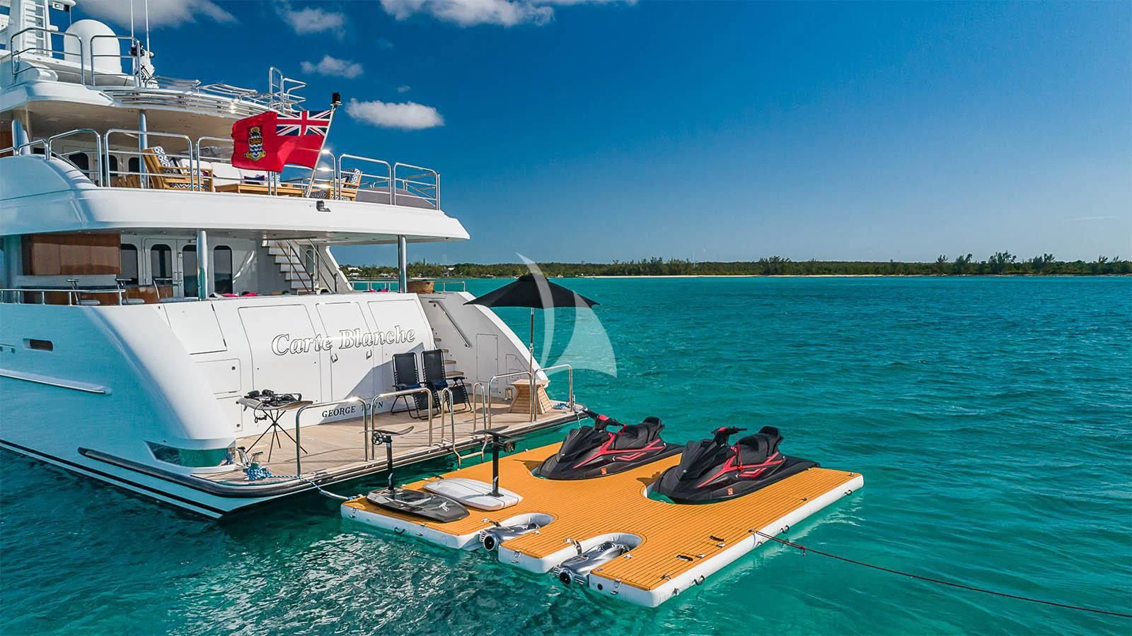 a boat docked at a pier aboard CARTE BLANCHE Yacht for Charter