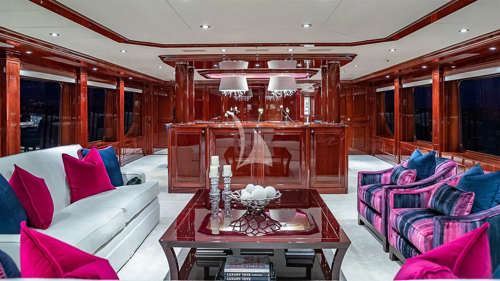 a living room with a piano aboard CARTE BLANCHE Yacht for Charter
