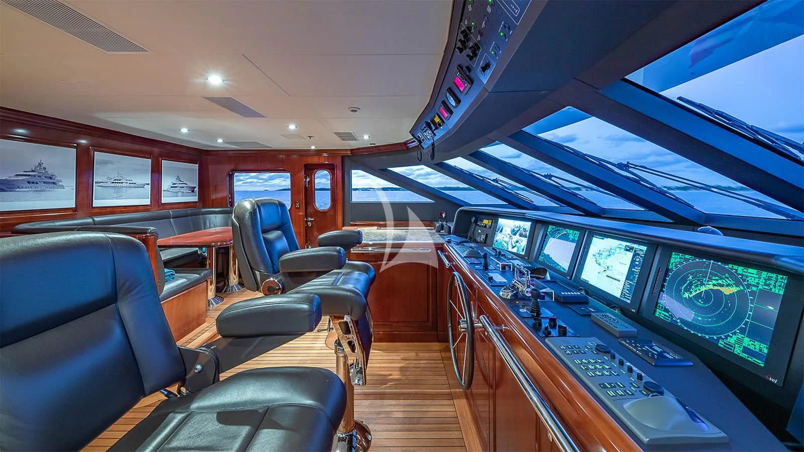 inside of a vehicle with monitors and seats and seats aboard CARTE BLANCHE Yacht for Charter