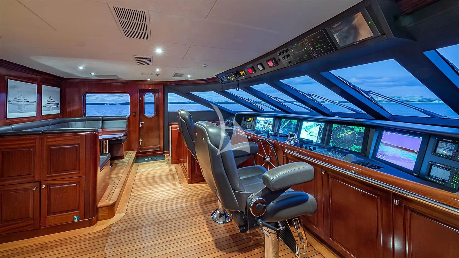 a room with a desk and chairs aboard CARTE BLANCHE Yacht for Charter