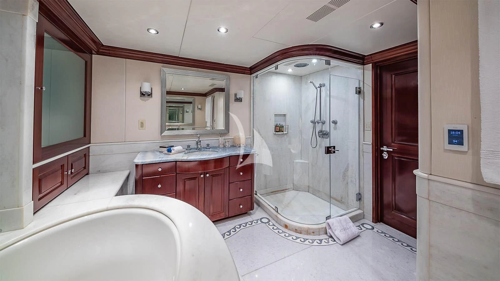 a bathroom with a glass shower aboard CARTE BLANCHE Yacht for Charter