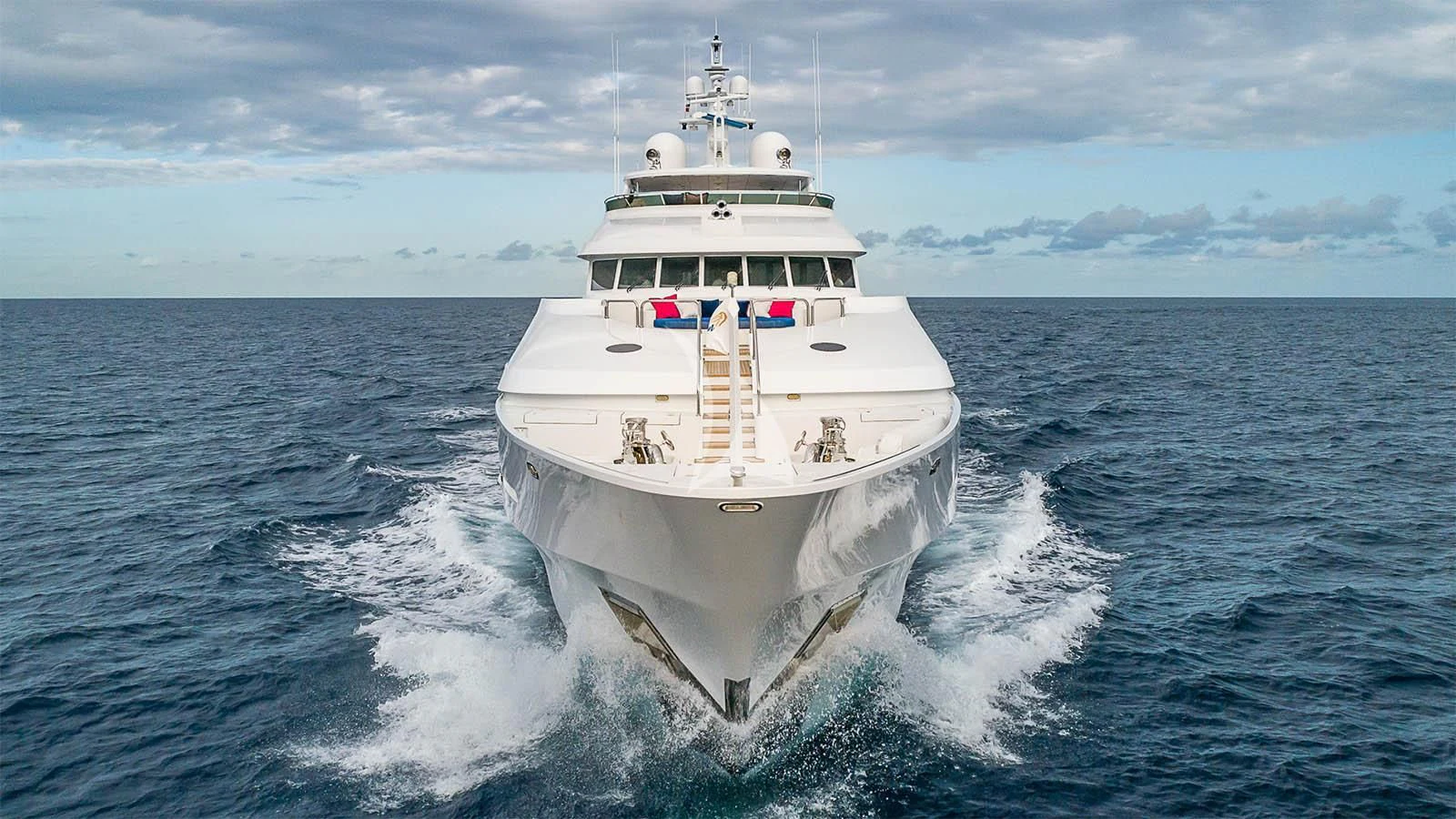 a large white boat in the water aboard CARTE BLANCHE Yacht for Charter