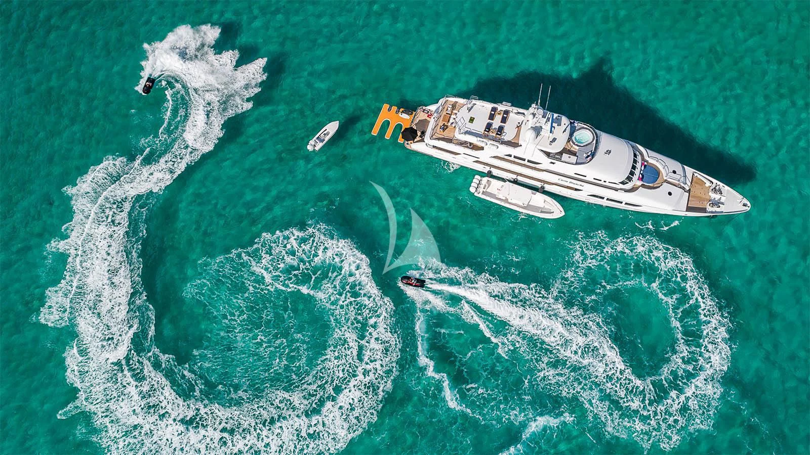 a plane flying over a sea aboard CARTE BLANCHE Yacht for Charter