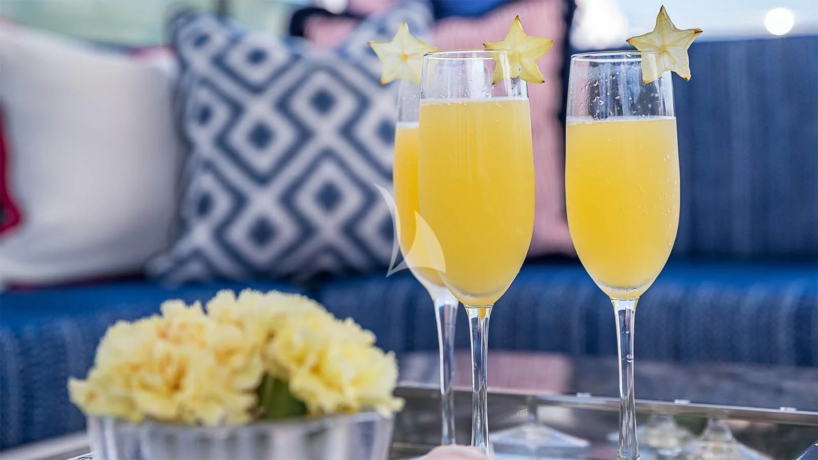 a group of glasses with drinks on a table aboard CARTE BLANCHE Yacht for Charter