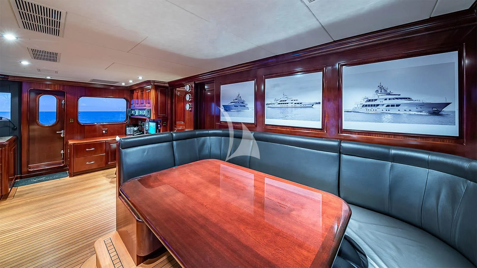 a room with a couch and a table aboard CARTE BLANCHE Yacht for Charter