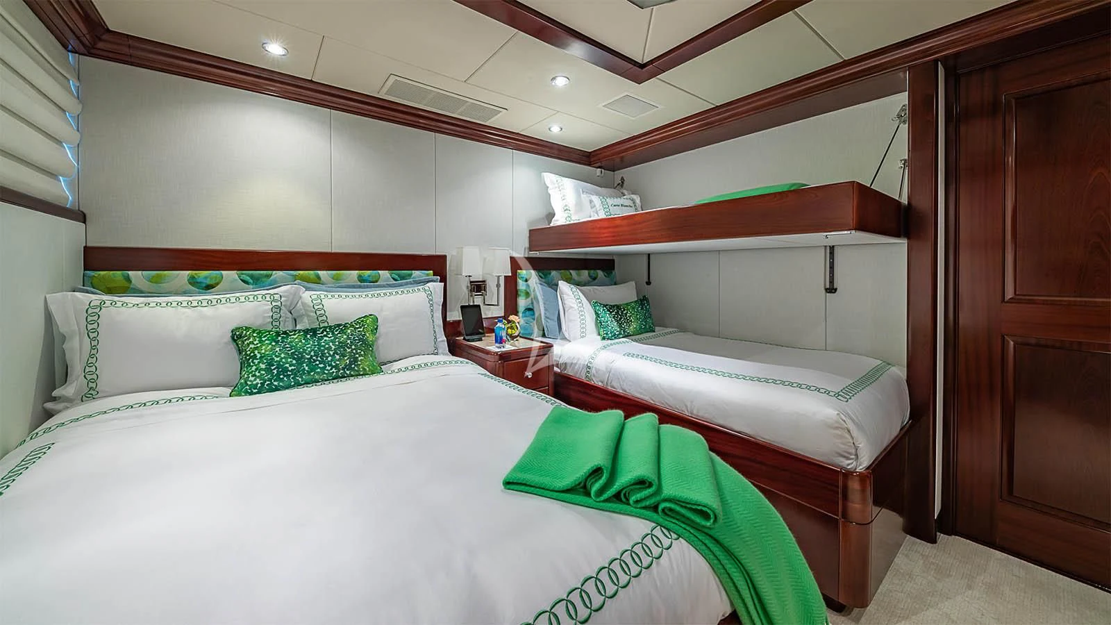 a couple of beds in a room aboard CARTE BLANCHE Yacht for Charter