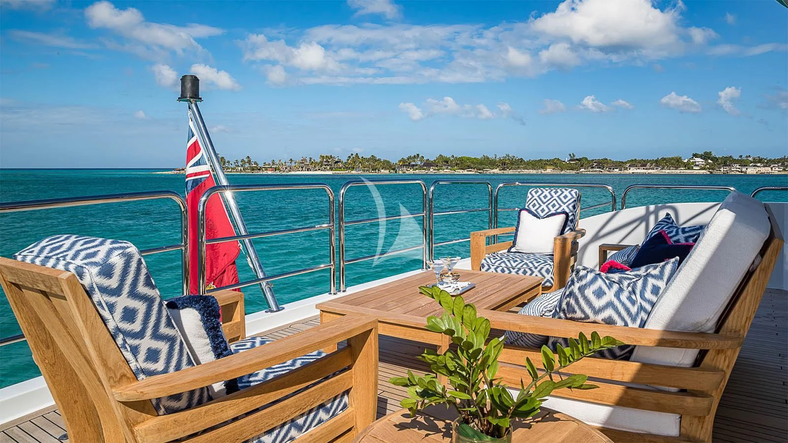 a deck with chairs and a table on it aboard CARTE BLANCHE Yacht for Charter