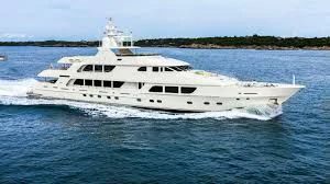 a large white ship in the water aboard CARTE BLANCHE Yacht for Charter