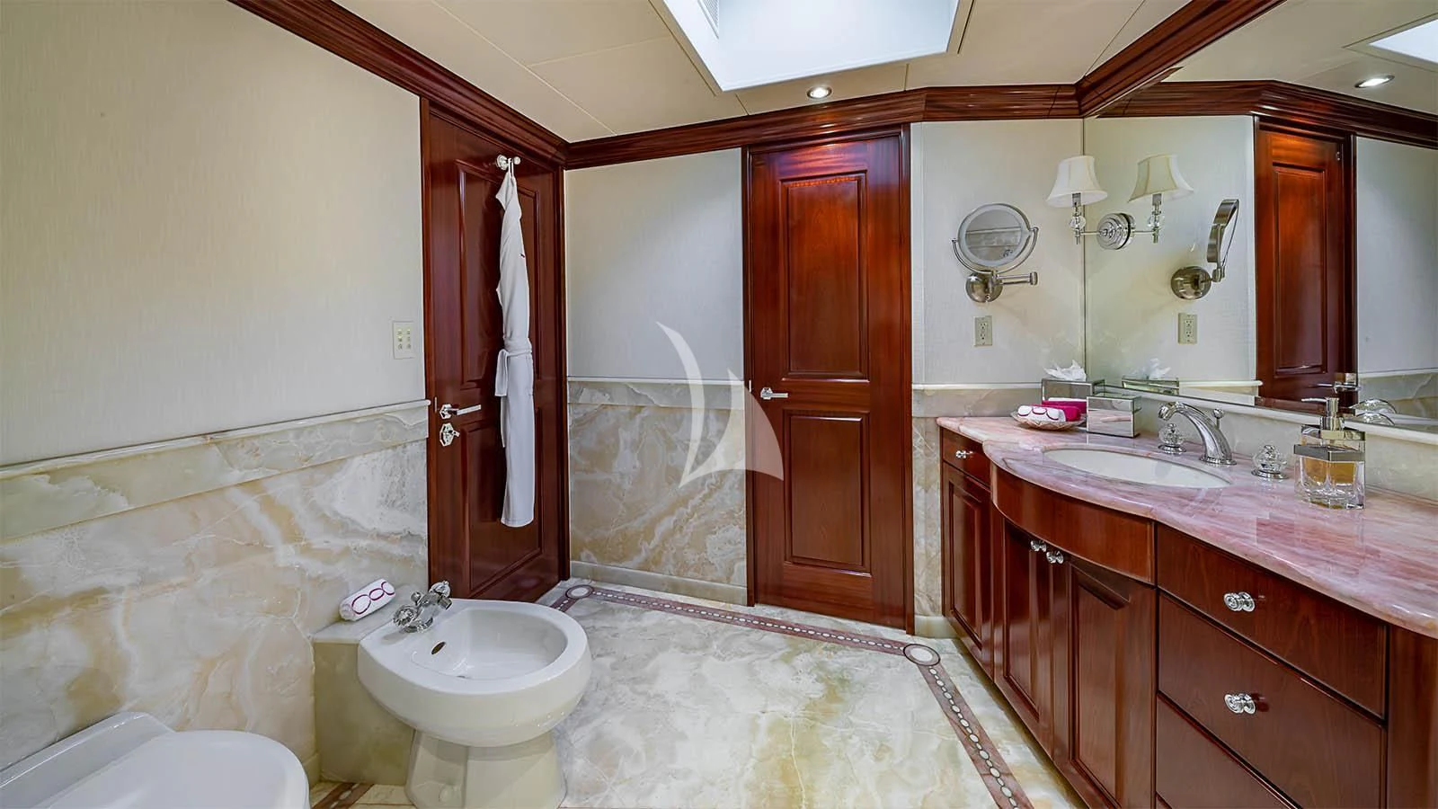 a bathroom with a tub sink and a sink aboard CARTE BLANCHE Yacht for Charter