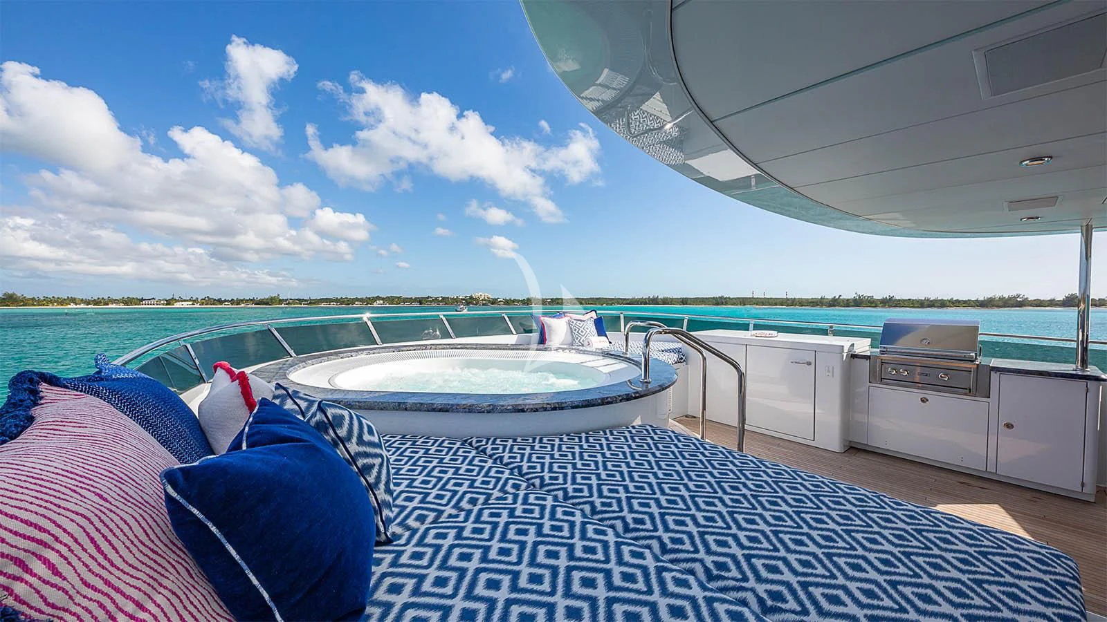 a deck with a pool and a deck and a boat on it aboard CARTE BLANCHE Yacht for Charter
